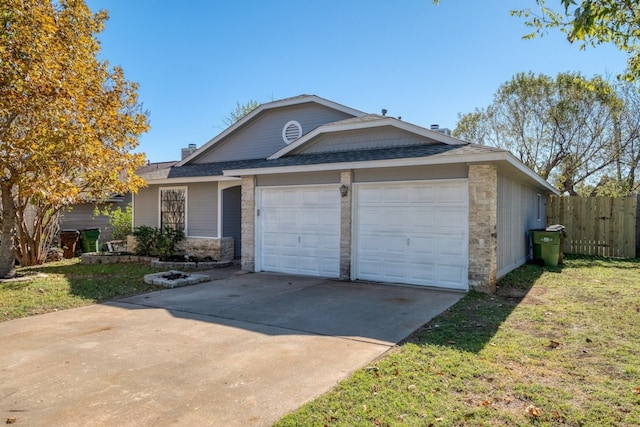 ranch-style house featuring a garage and a front lawn