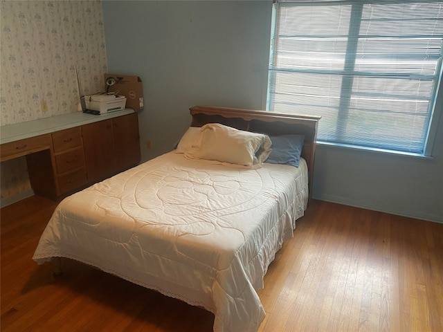 bedroom with wood-type flooring