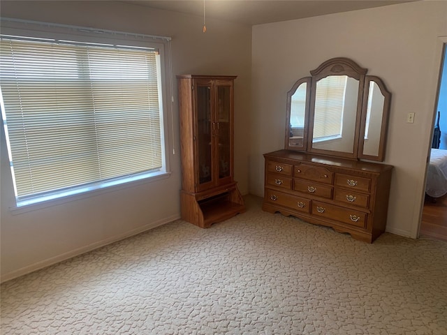 unfurnished bedroom with carpet flooring