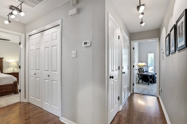 hallway featuring dark hardwood / wood-style flooring