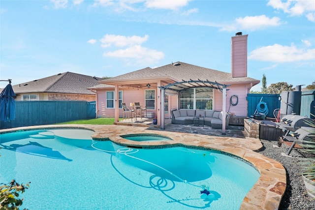 view of swimming pool with an outdoor living space, a patio area, a pergola, and an in ground hot tub