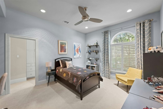 bedroom featuring ceiling fan and light colored carpet