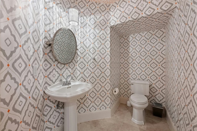 bathroom with tile patterned floors and toilet