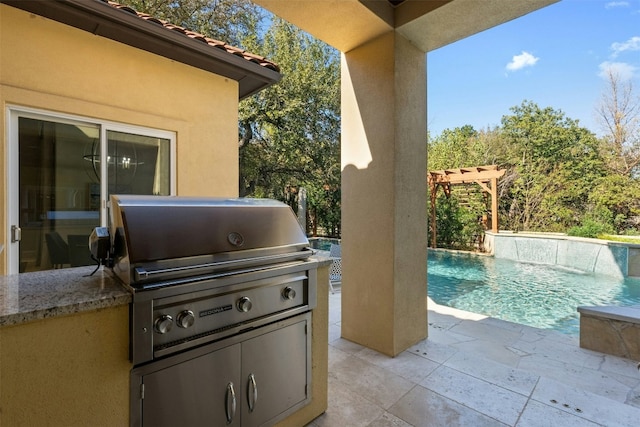 view of patio / terrace featuring pool water feature, a pergola, area for grilling, and grilling area