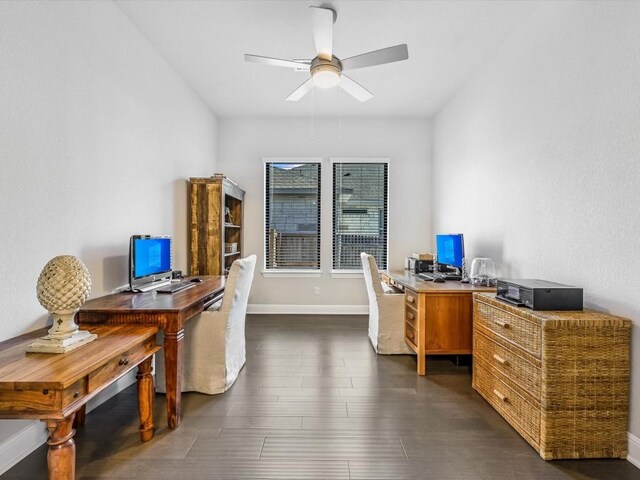 home office featuring dark hardwood / wood-style floors and ceiling fan