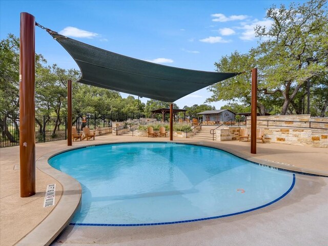 view of pool featuring a patio area