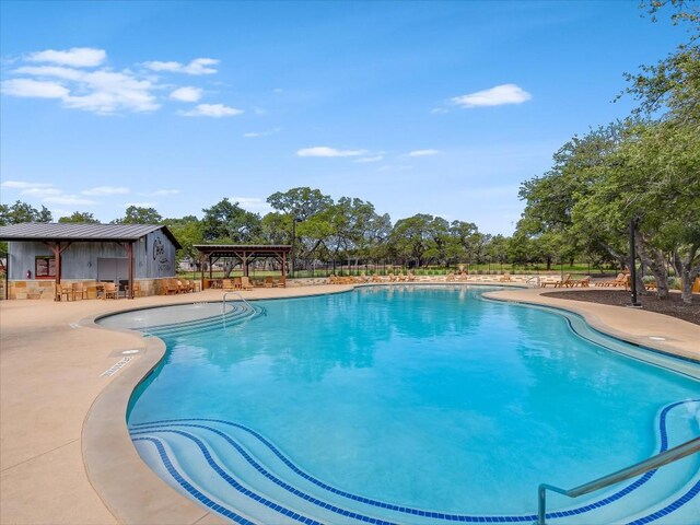 view of pool featuring a patio