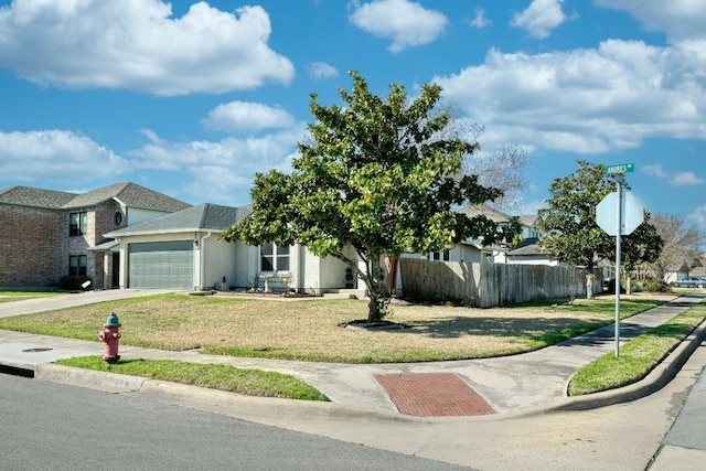 view of front of house featuring a front yard and a garage