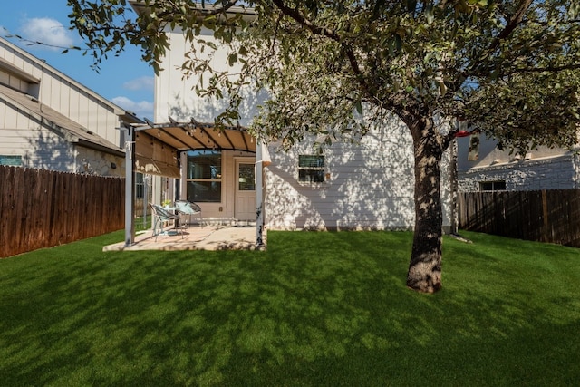 back of property featuring a lawn, a patio, and a pergola