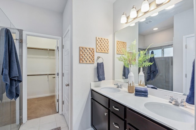 bathroom featuring vanity, tile patterned floors, and an enclosed shower