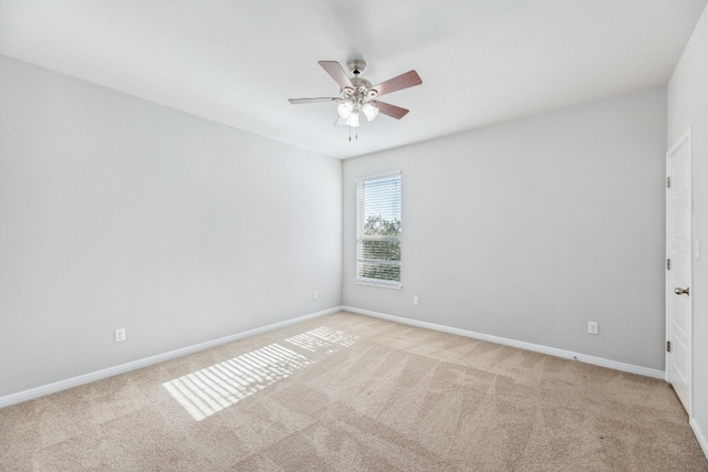 carpeted empty room with ceiling fan