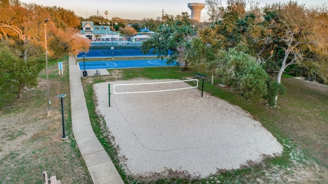 surrounding community with tennis court and basketball hoop