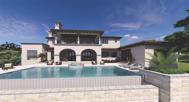 back of house featuring a patio area and a balcony