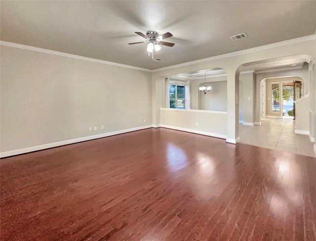 spare room with hardwood / wood-style flooring and crown molding