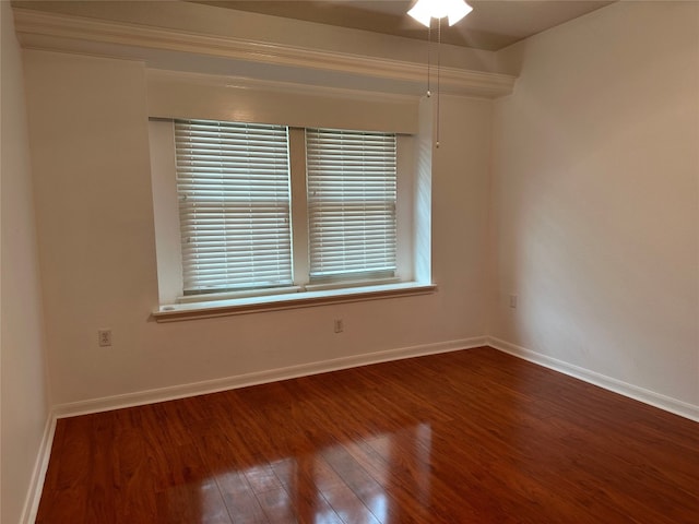 unfurnished room with dark hardwood / wood-style floors