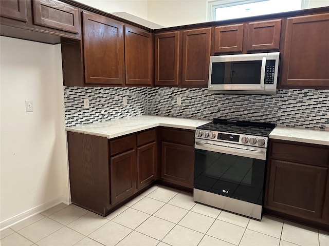 kitchen with decorative backsplash and appliances with stainless steel finishes