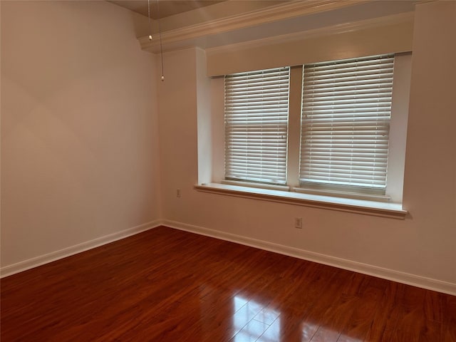 unfurnished room with wood-type flooring and crown molding