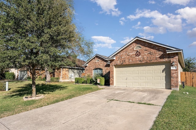 view of front of house with a garage and a front yard