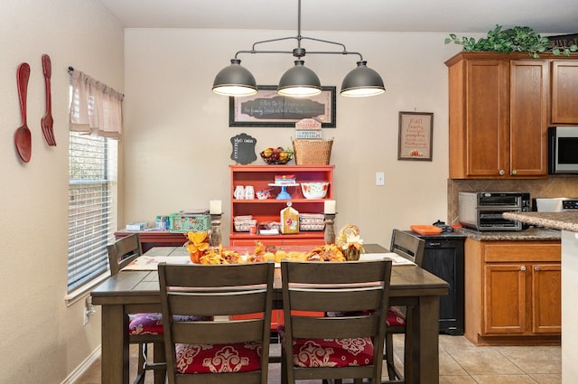 dining space with light tile patterned floors