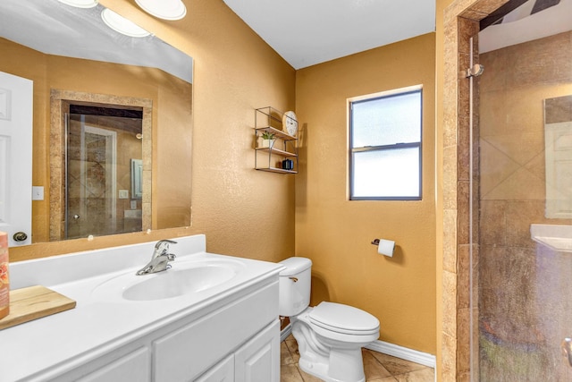 bathroom featuring toilet, an enclosed shower, tile patterned floors, and vanity