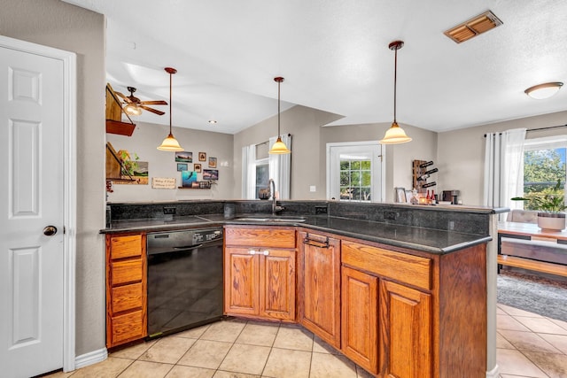 kitchen featuring sink, ceiling fan, dishwasher, and hanging light fixtures