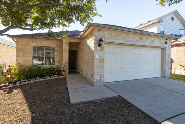 single story home with a garage