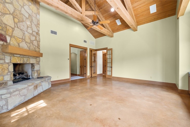 unfurnished living room with ceiling fan, wooden ceiling, high vaulted ceiling, beamed ceiling, and a fireplace