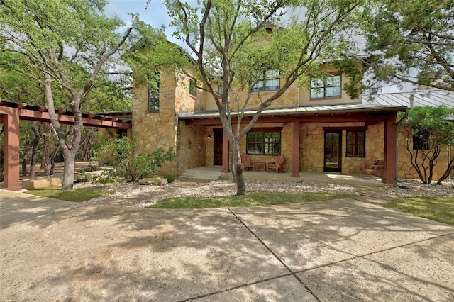 view of front of home with a patio area