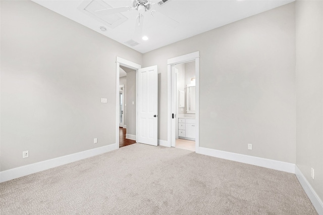 unfurnished bedroom with carpet, connected bathroom, and ceiling fan