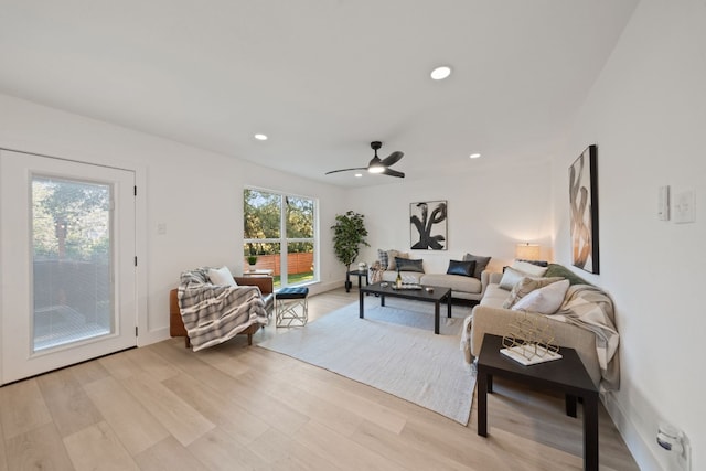 living room featuring ceiling fan and light wood-type flooring