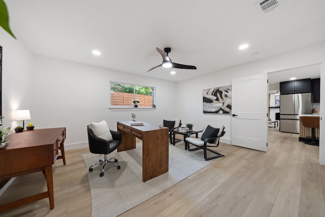 office area featuring light hardwood / wood-style floors and ceiling fan