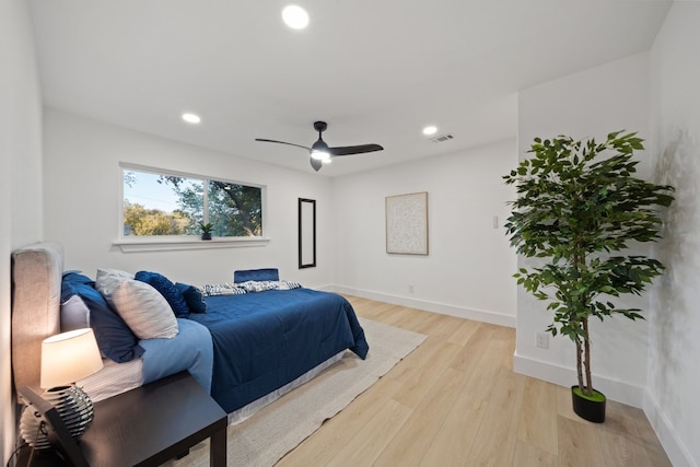 bedroom featuring ceiling fan and light hardwood / wood-style flooring