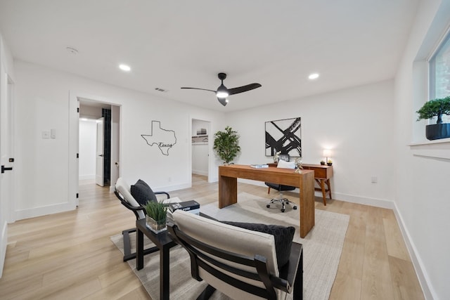 office area with ceiling fan and light hardwood / wood-style flooring