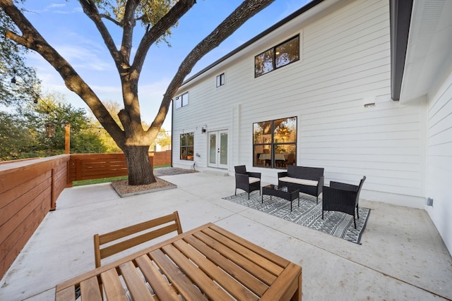 view of patio / terrace with an outdoor living space and french doors