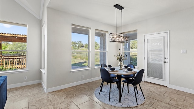 dining area featuring an inviting chandelier