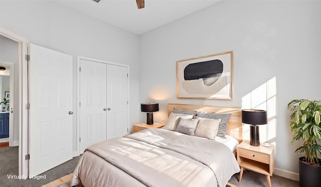 carpeted bedroom featuring ceiling fan and a closet