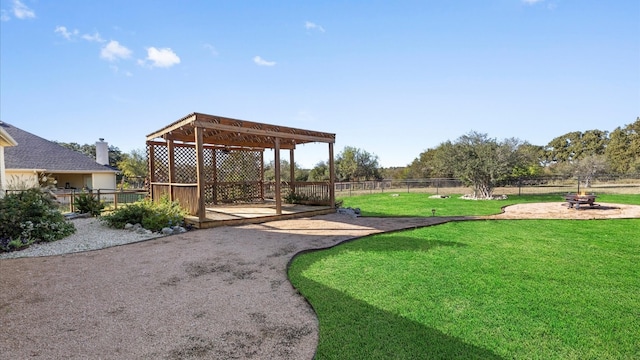 view of home's community featuring a pergola and a lawn