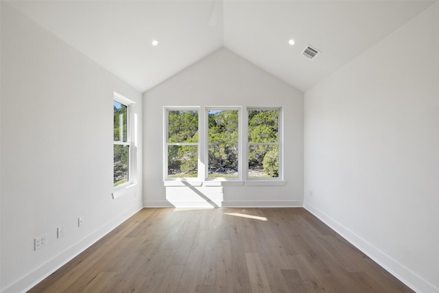 unfurnished room featuring dark hardwood / wood-style flooring and high vaulted ceiling