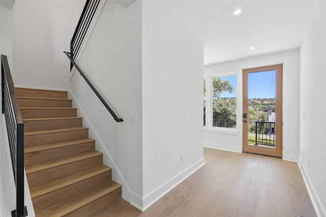 stairway featuring hardwood / wood-style floors