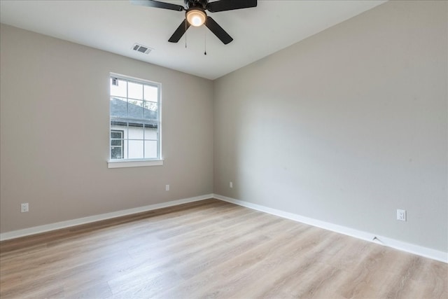 spare room with light hardwood / wood-style flooring and ceiling fan