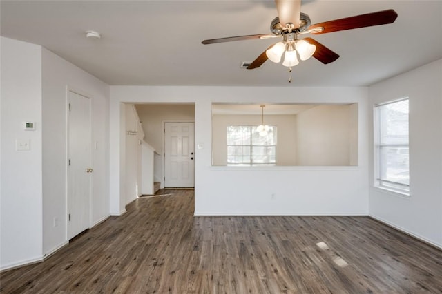 spare room featuring ceiling fan and dark hardwood / wood-style flooring