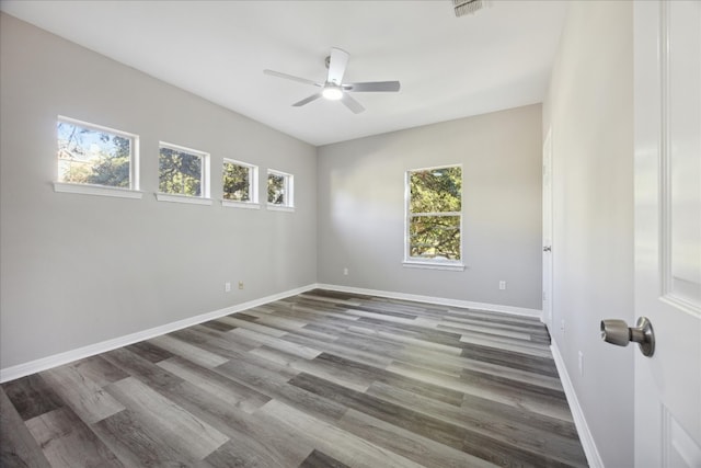 spare room with wood-type flooring and ceiling fan