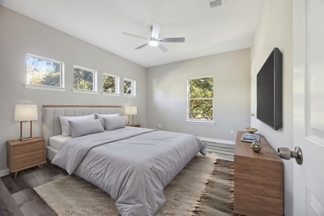 bedroom featuring ceiling fan and dark hardwood / wood-style floors