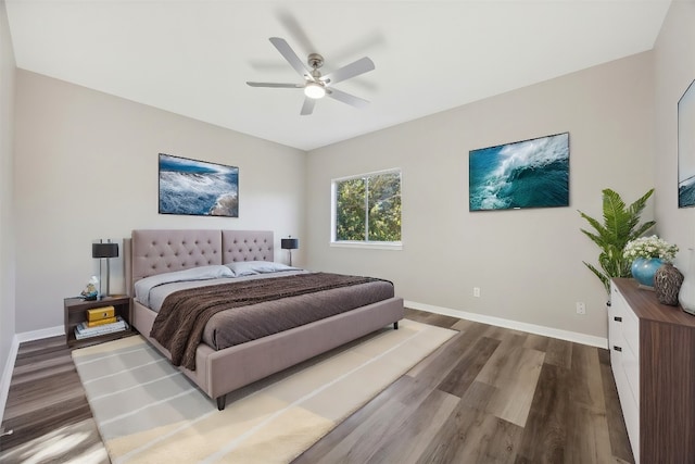 bedroom with ceiling fan and hardwood / wood-style flooring