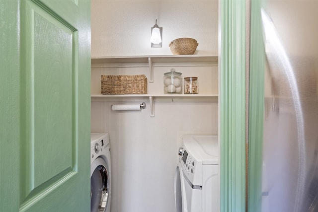 washroom with independent washer and dryer