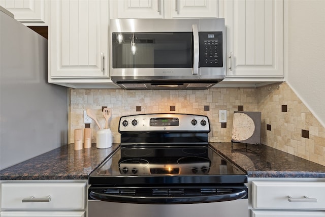 kitchen with white cabinetry, appliances with stainless steel finishes, and tasteful backsplash