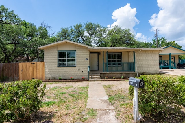 ranch-style home with covered porch