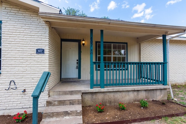 property entrance featuring covered porch