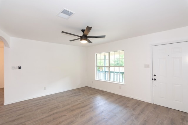 unfurnished room featuring wood-type flooring and ceiling fan