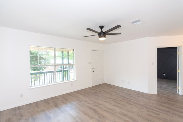 spare room with wood-type flooring and ceiling fan